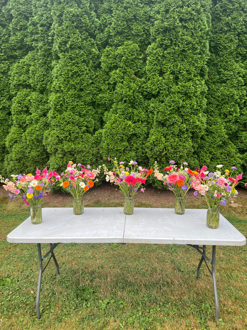 Lined-up jar bouquets