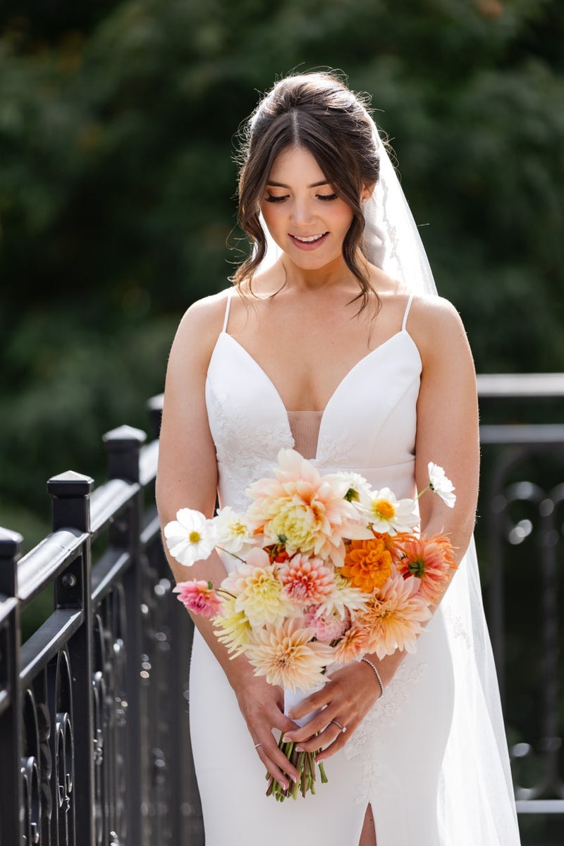 Bride looking at her bouquet