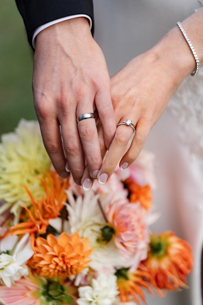 Couple's hands and bands