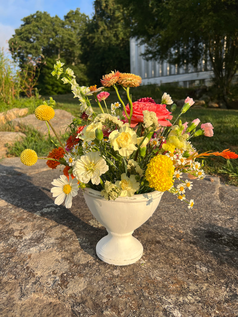 Urn arrangement on the stone wall